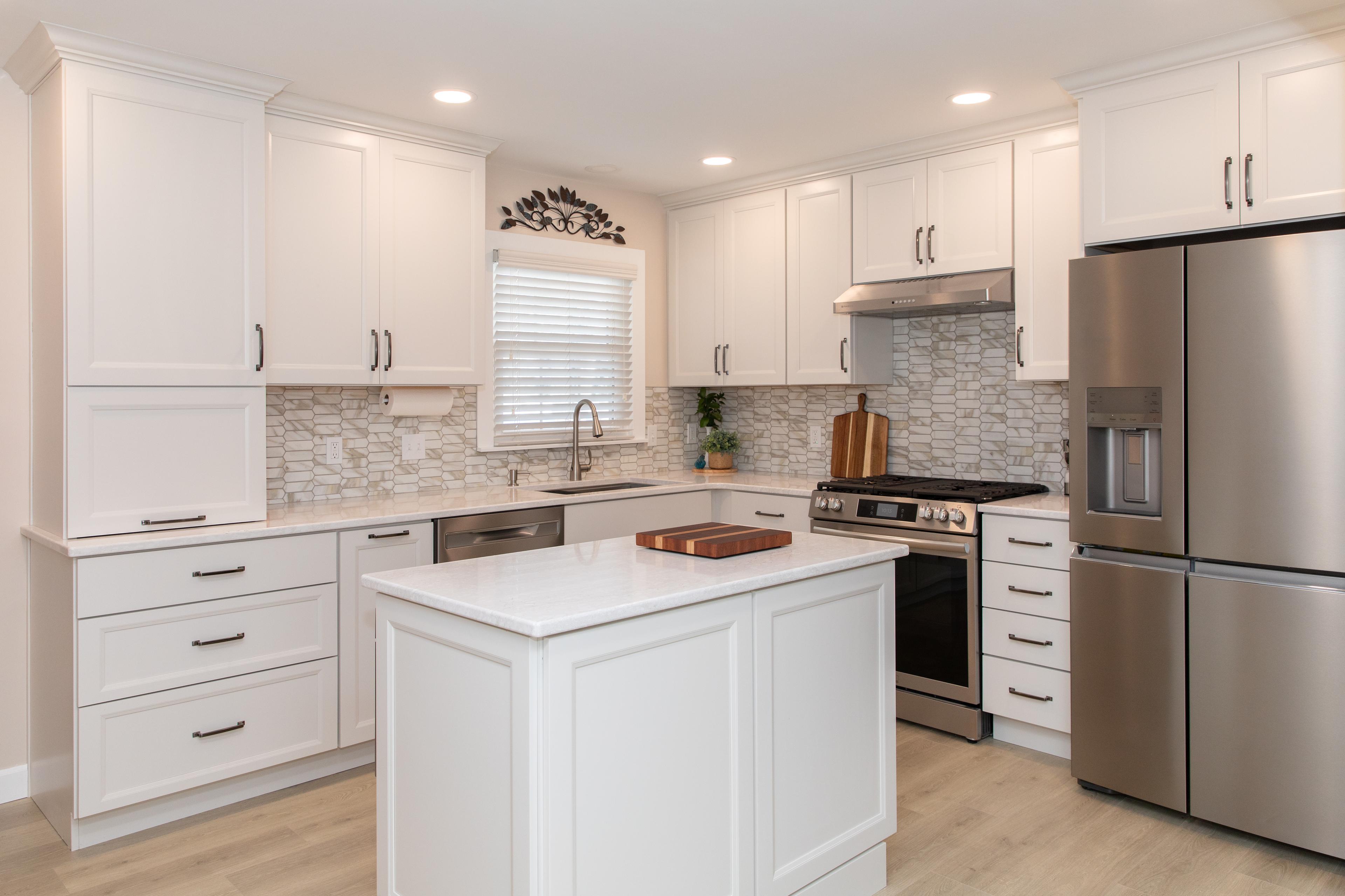 Kitchen remodel with white cabinetry and island